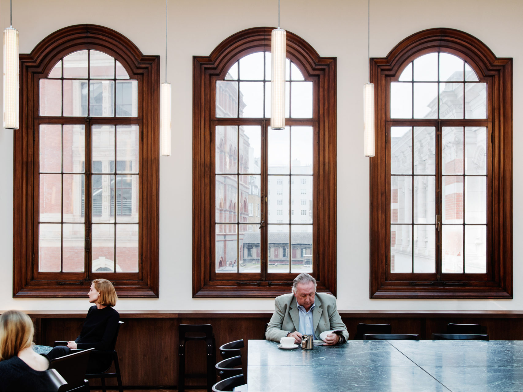 Man Sat Having Coffee in V&A Room